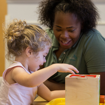 teacher working with student